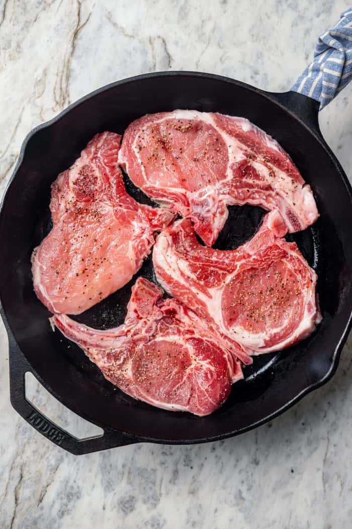 pork chops in a cast iron skillet