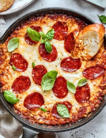 overhead photo of pizza dip in a cast iron skillet