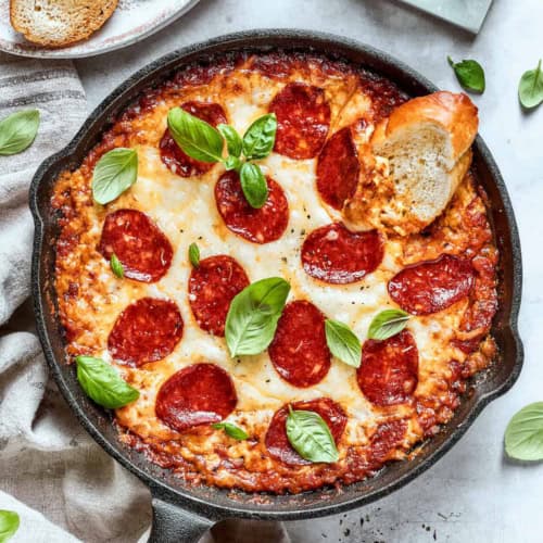 overhead photo of pizza dip in a cast iron skillet