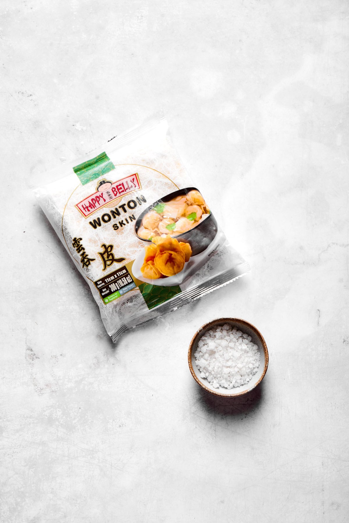 These easy homemade wonton chips have the most fantastic crunch and a salty flavor that makes them pair with just about anything! Overhead view of ingredients for wonton chips