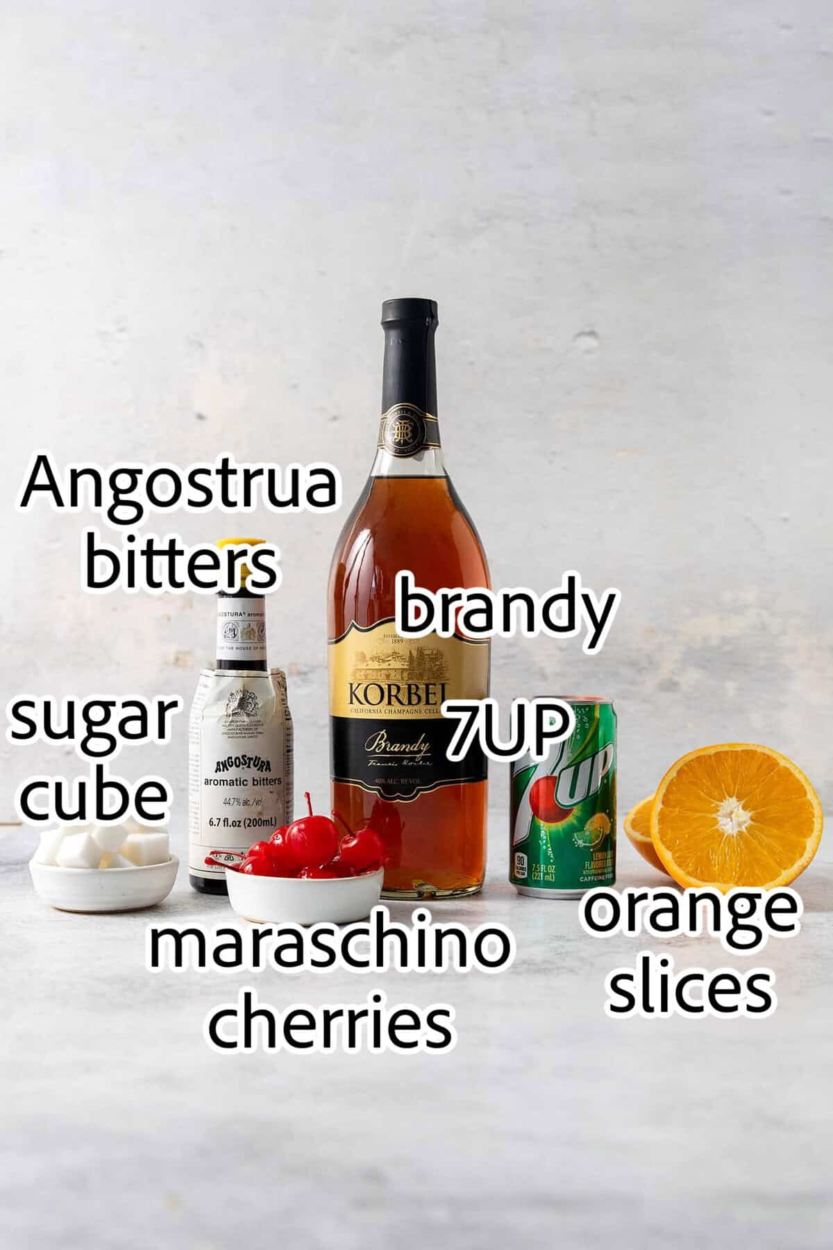 Make a Brandy Old Fashioned for a twist on an Old Fashioned Cocktail! You'll use brandy, a dash of bitters, and orange slices. ingredients to make brandy old fashioned cocktail