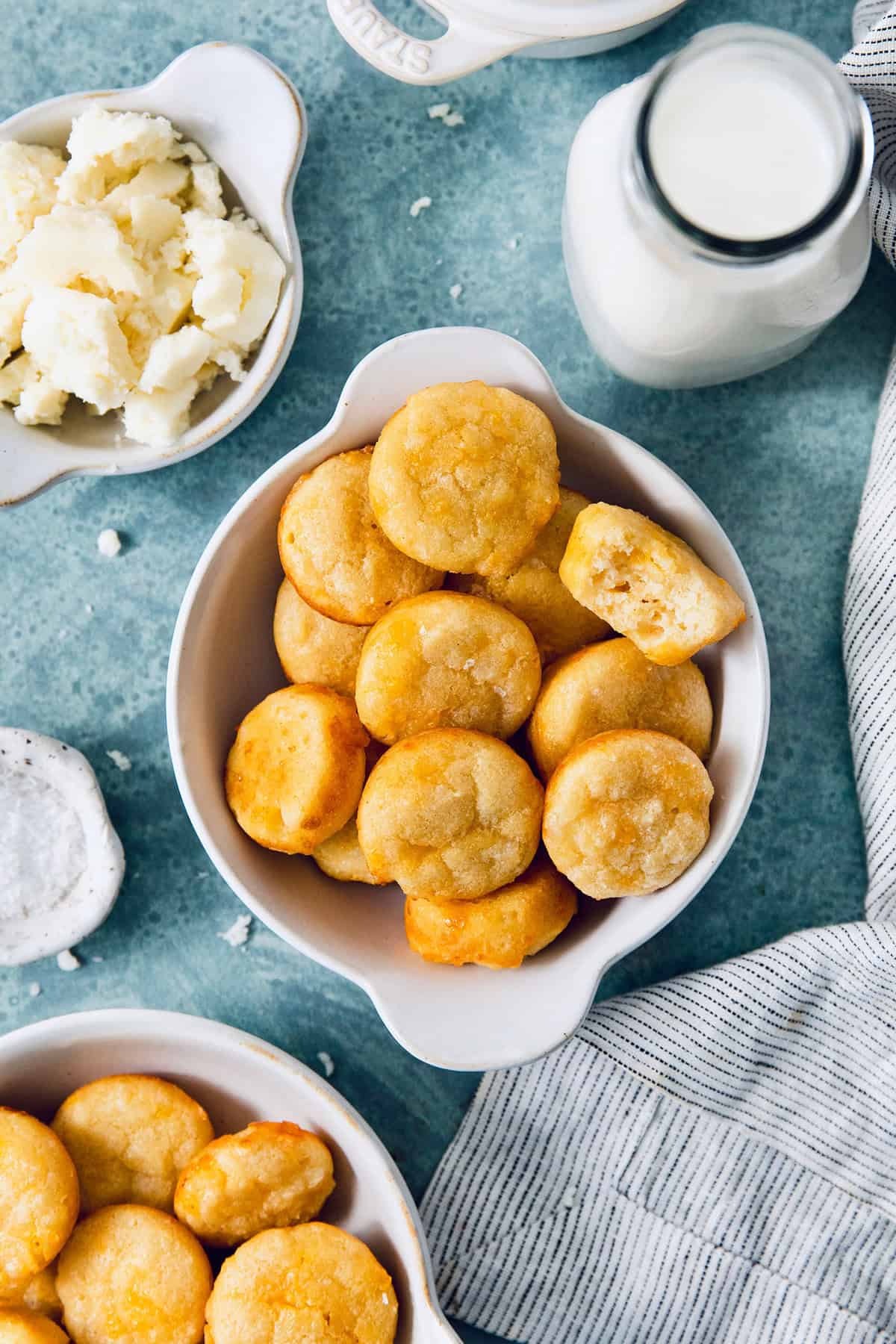 This Colombian Pandebono recipe is fantastically cheesy, surprisingly easy, and irresistibly tender and fluffy. So delicious! Colombian pandebono in bowl