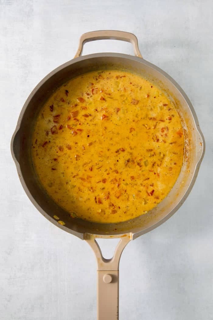 This easy Shrimp Curry recipe combines elements of Thai and Indian curries for a uniquely delicious weeknight meal. So quick and easy! Sauce for shrimp curry in pan