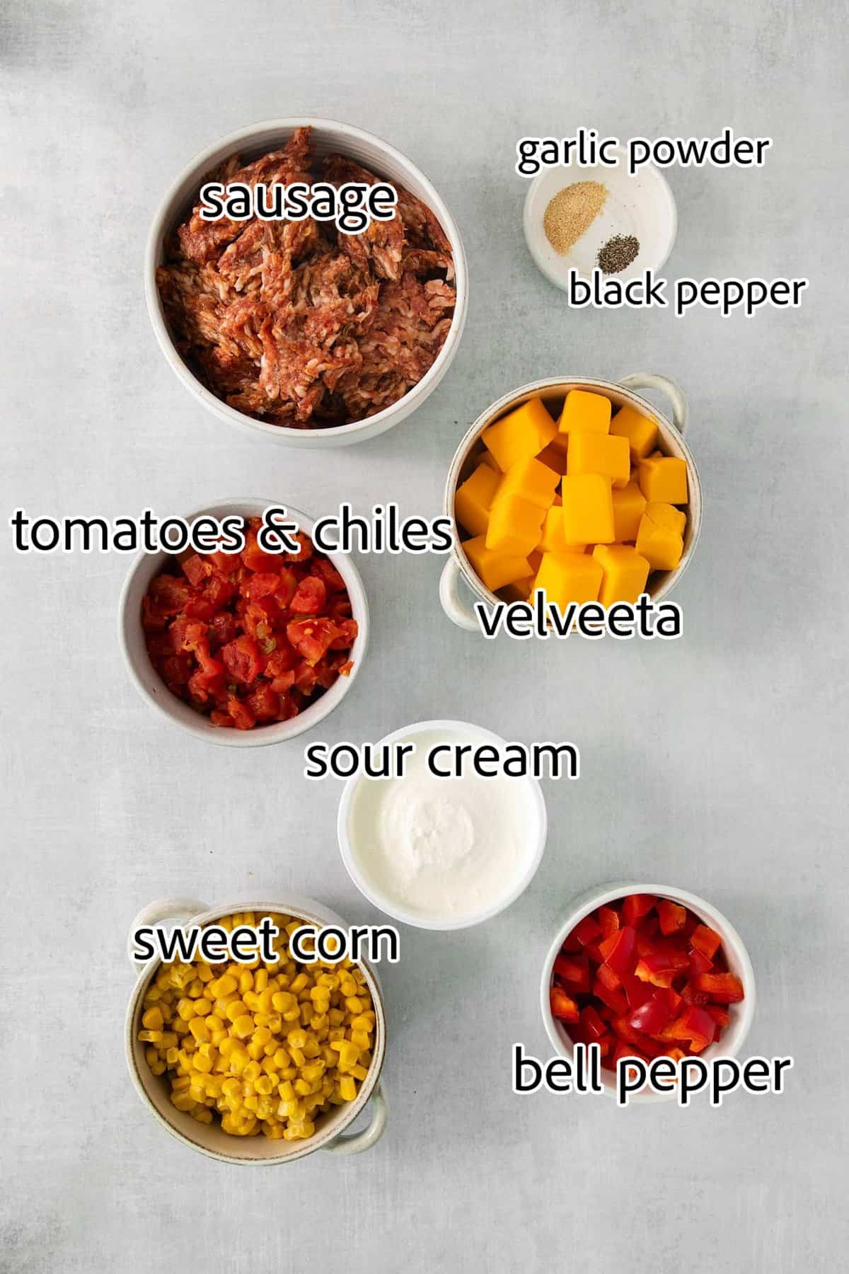 This gorgeously cheesy Sausage Dip takes a creamy base of Velveeta and sour cream and swirls it with spicy sausage and juicy corn kernels. ingredients for cheesy corn sausage dip