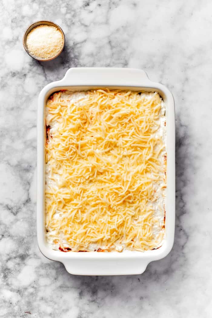 Lasagna beans pair creamy gigante beans with zippy tomato sauce, Italian sausage and ricotta, and it's all topped with even more cheese. Yum! Mozzarella added to dish of lasagna beans