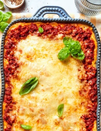 overhead photo of spaghetti casserole in a blue baking dish