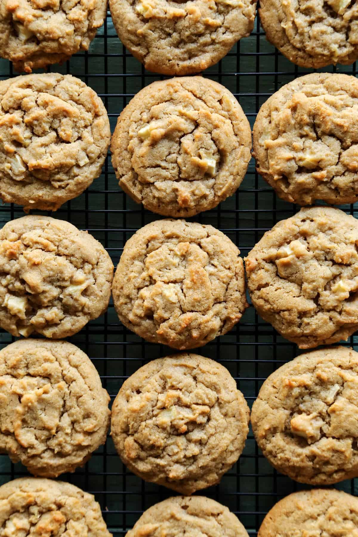 overhead photo of peanut butter apple cookies on a cooling rack