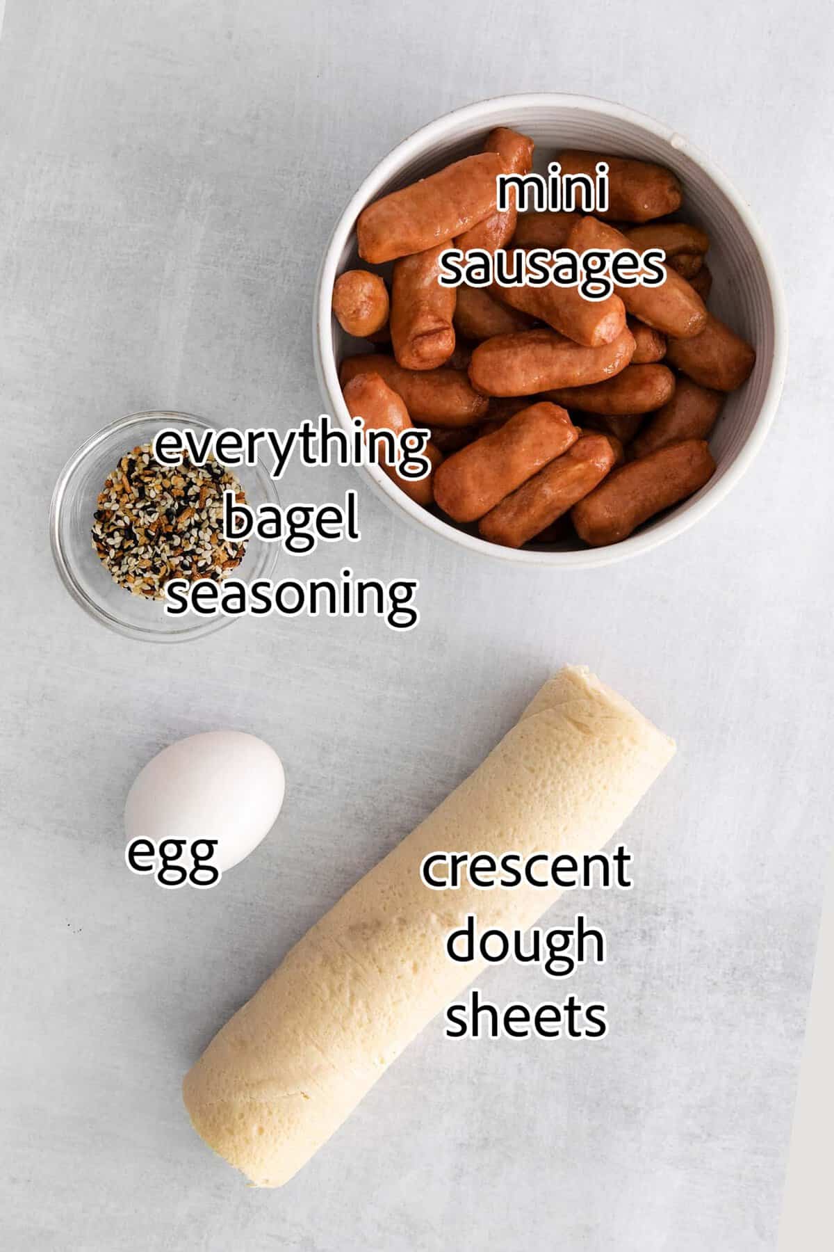 Everything Bagel Pigs in a Blanket are the perfect appetizer– mini sausage wrapped in crescent dough, topped with everything bagel seasoning ingredients needed for everything bagel pigs in a blanket
