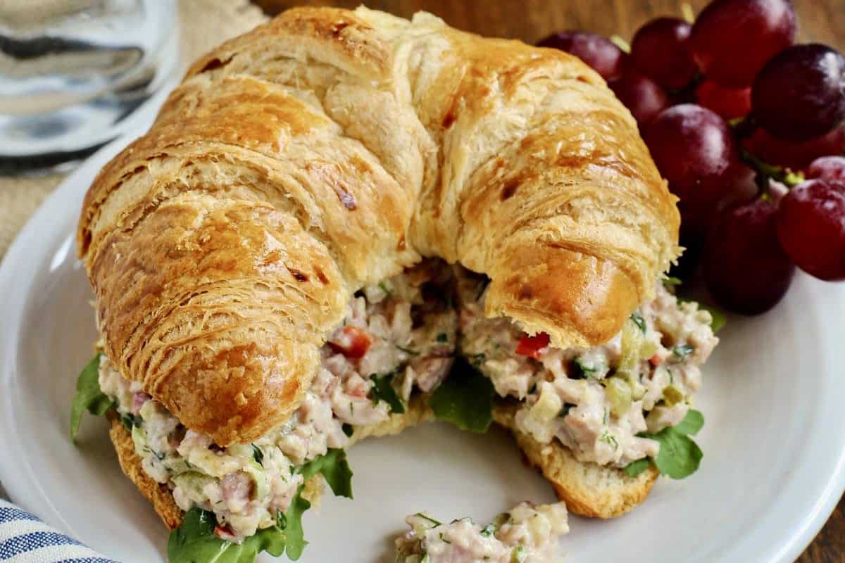 a croissant stuffed with ham salad