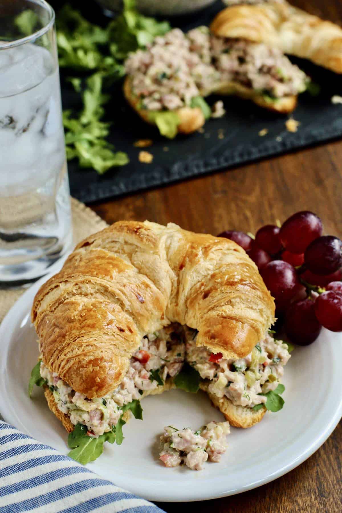 Ham Salad makes the best use of leftover ham! It's creamy and tangy, packed with crunchy vegetables, salty ham, and sweet pickle relish. creamy ham salad on a croissant