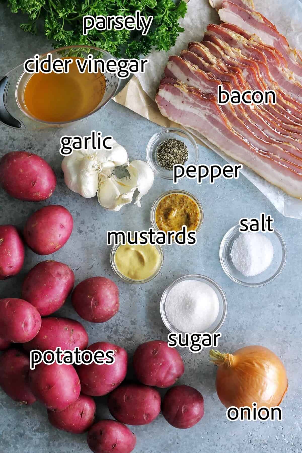 This warm German potato salad recipe combines tender red potatoes with bites of crispy bacon in a tangy vinegar and mustard dressing. ingredients needed for german potato salad