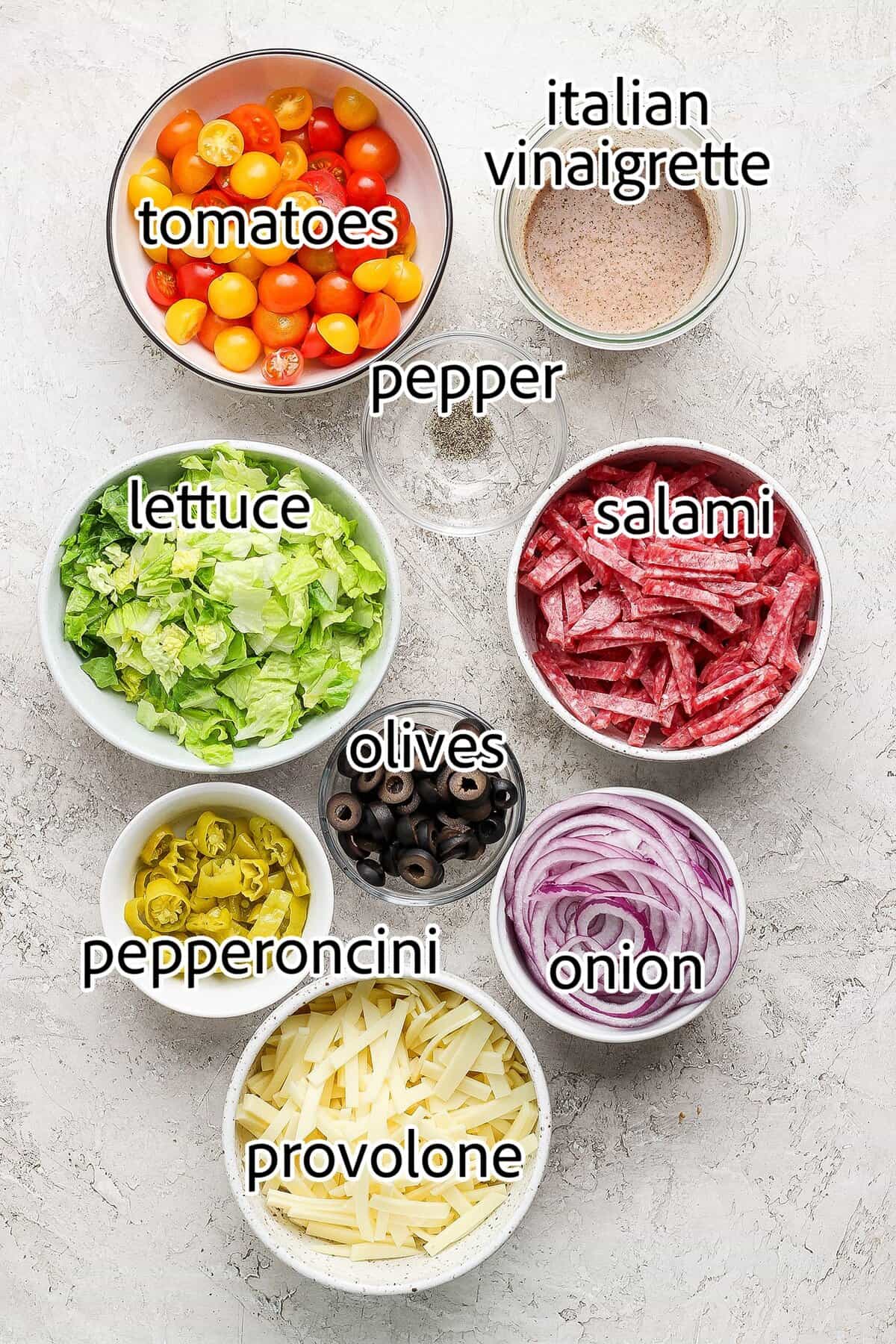 This Italian Chopped Salad is loaded with fresh veggies, salami, provolone, pepperoncini, and olives for a flavorful, satisfying meal! ingredients needed for italian chopped salad