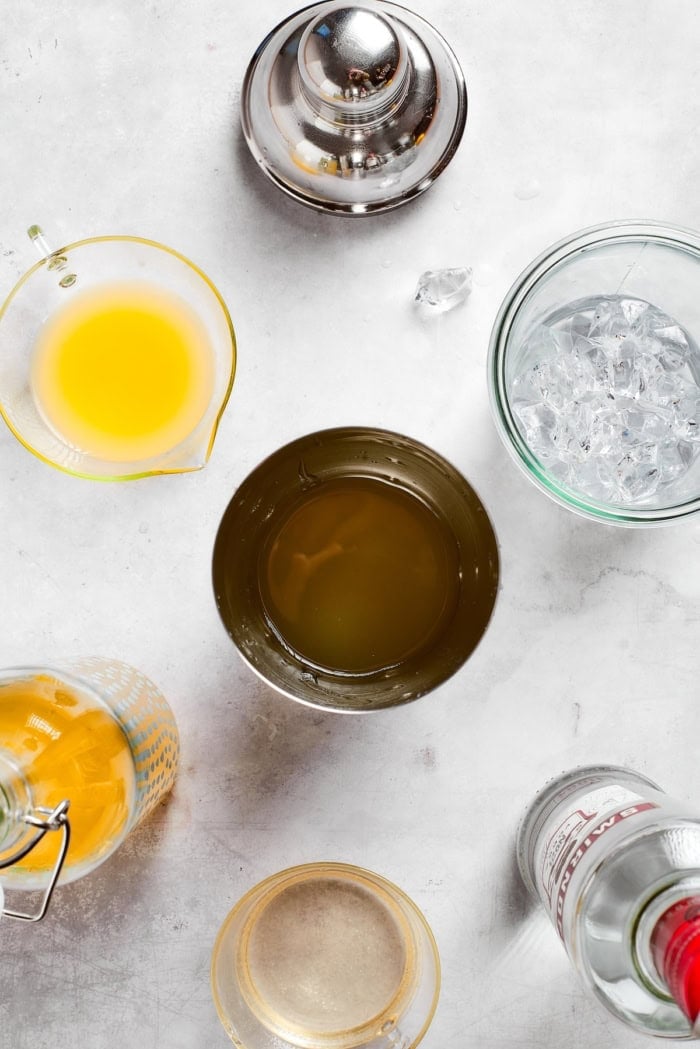 This limoncello martini is the brightest, sunniest cocktail you’ll ever sip! It’s tart yet smooth, with just the right balance of sweetness. Overhead view of cocktail shaker and ingredients for limoncello martini
