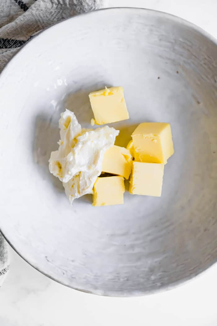 cream cheese and butter in a large bowl
