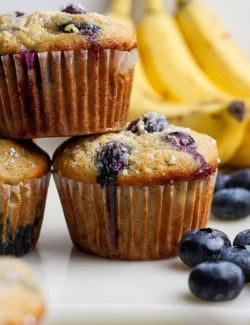 Closeup of 3 stacked banana blueberry muffins