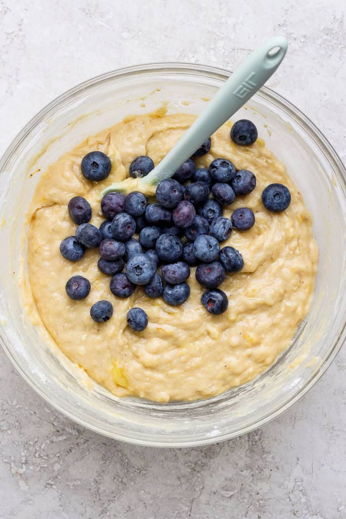 Banana Blueberry Muffins combine two classic recipes into one moist, lofty, perfectly sweet muffin package. They're such a treat! Stirring blueberries into muffin batter