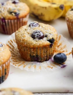 Closeup of banana blueberry muffin with wrapper pulled off