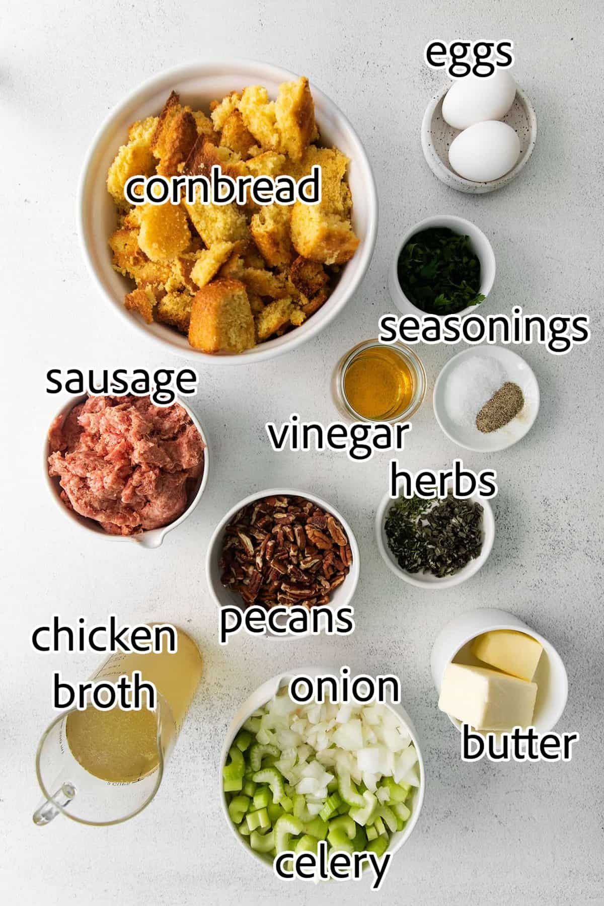Cornbread sausage dressing ingredients with text labels overlaying each ingredient.