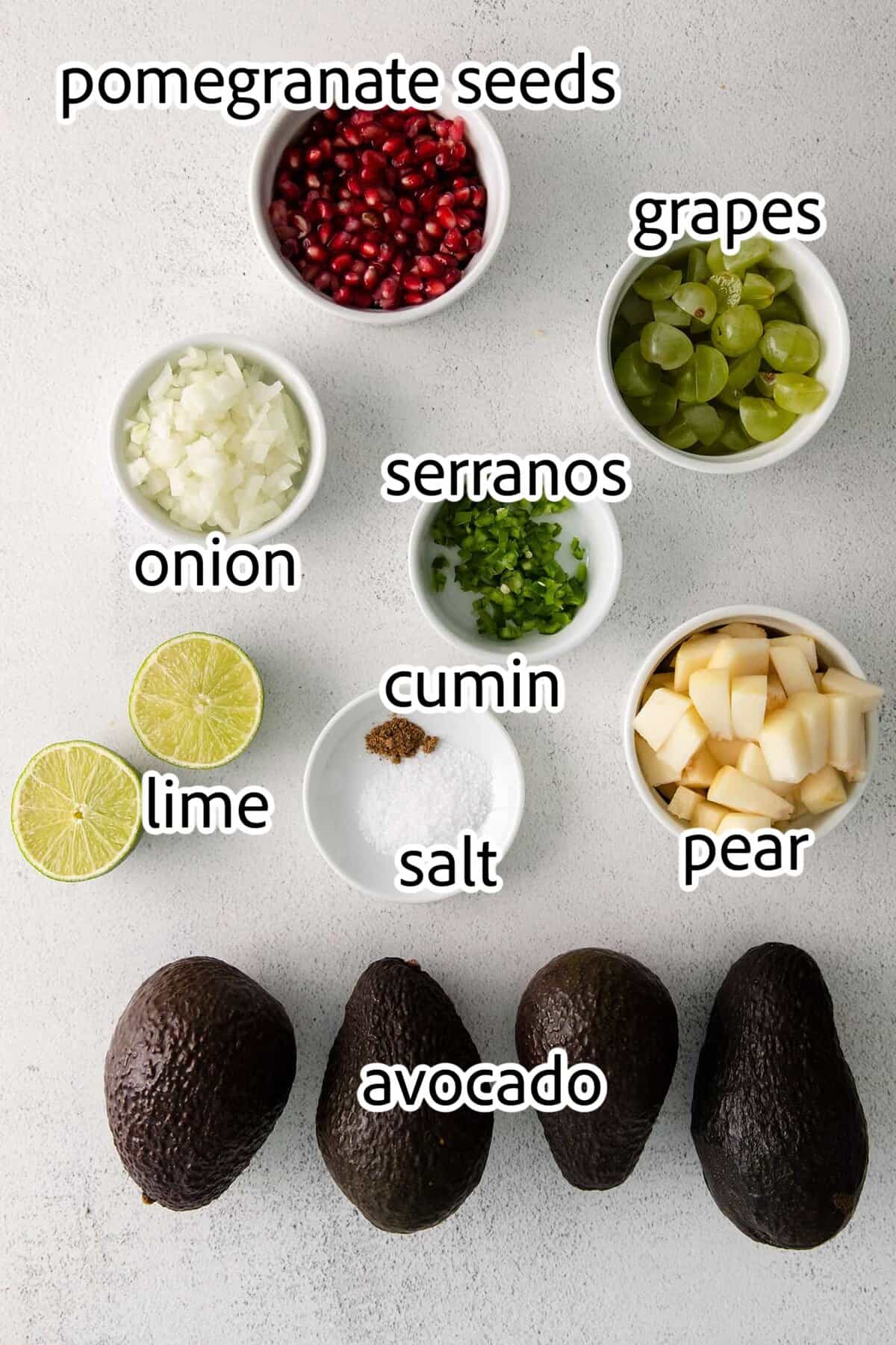 With sweet pops of fruit and pomegranate seeds, this Holiday Guacamole is a quick and festive party appetizer! Delicious with tortilla chips! ingredients needed for holiday guacamole