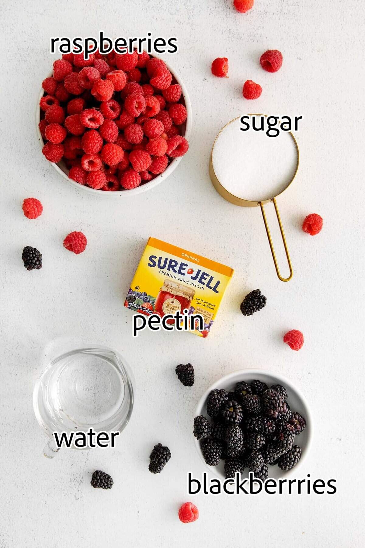 This Raspberry Blackberry Freezer Jam comes together in less than an hour, with just 4 ingredients. No cooking or canning is required! ingredients needed for raspberry blackberry freezer jam