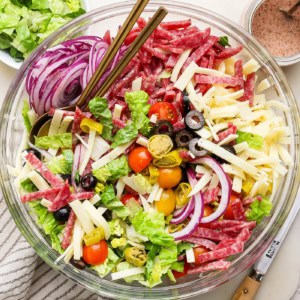 overhead photo of Italian chopped salad in a clear serving bowl