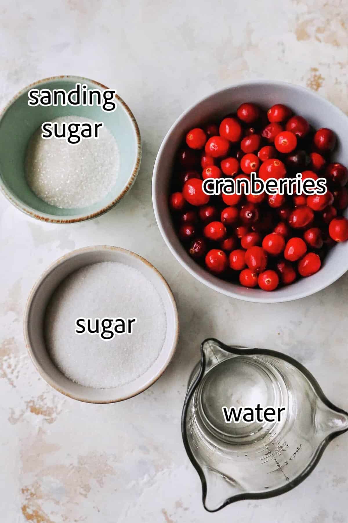 Sugared cranberries are the perfect sparkling finish for all your holiday desserts! All it takes is fresh cranberries, sugar, and water. ingredients needed for sugared cranberries