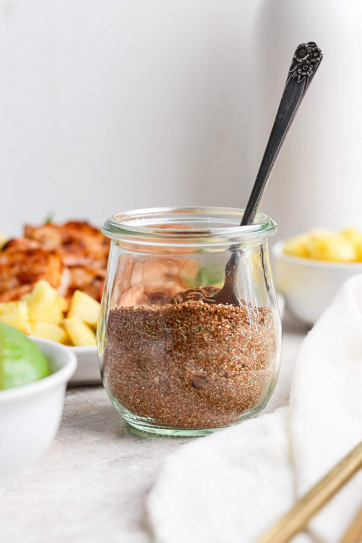 Jar of jerk seasoning with spoon