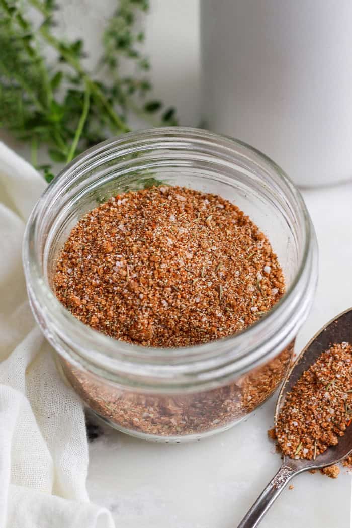 Jerk seasoning in jar and on spoon