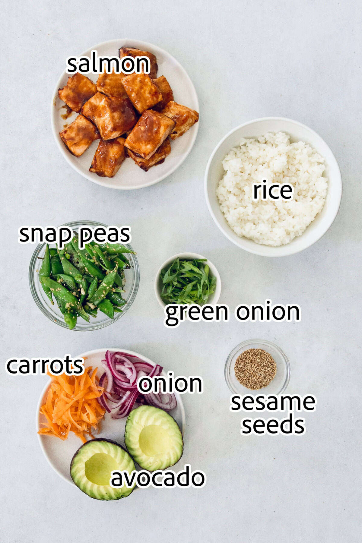 Teriyaki salmon bowls are an easy dinner ready in less than 20 minutes, with tender salmon, sticky teriyaki sauce, and lots of fresh veggies! ingredients needed for teriyaki salmon bowls