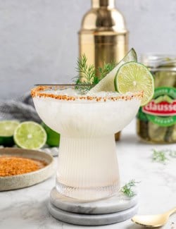 a glass of pickle margarita