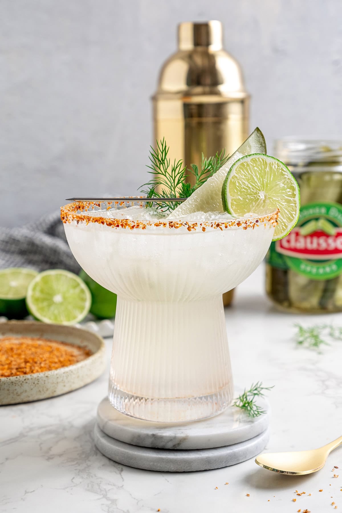 This Pickle Margarita recipe is bright and citrusy just like the classic, but it has a little extra pop of flavor to make it truly special! a glass of pickle margarita