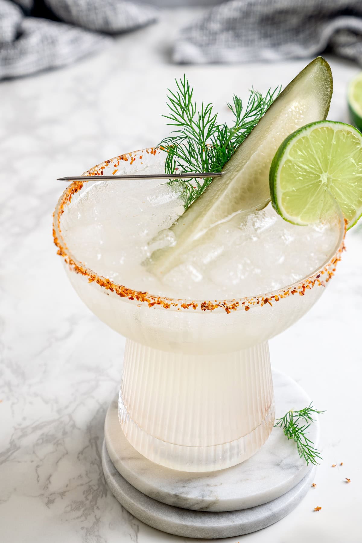 This Pickle Margarita recipe is bright and citrusy just like the classic, but it has a little extra pop of flavor to make it truly special! Pickle margarita garnished with pickle spear, dill, and lime wheel