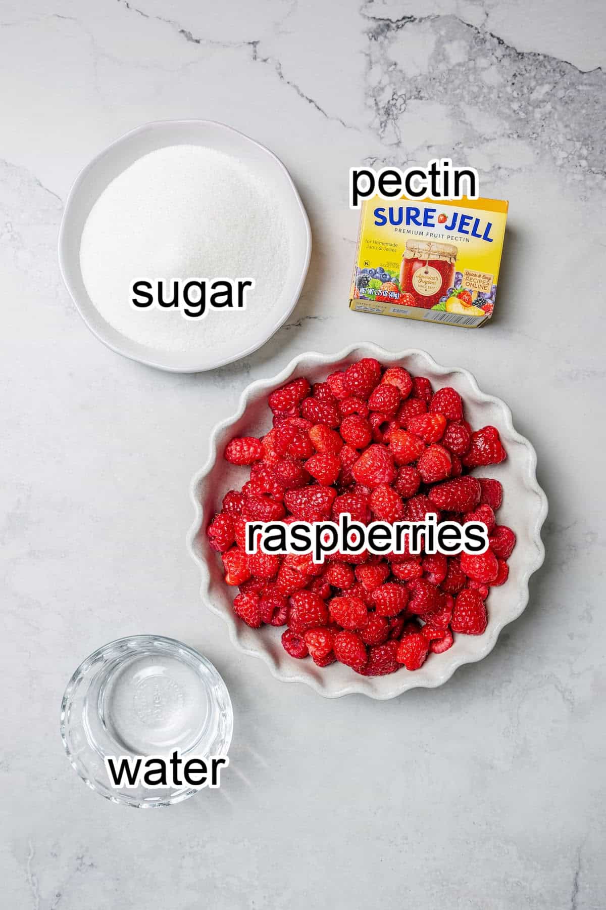 This Raspberry Freezer Jam is the easiest you'll ever make—no canning needed! It's a delicious way to extended the life of your berries. ingredients needed for raspberry freezer jam