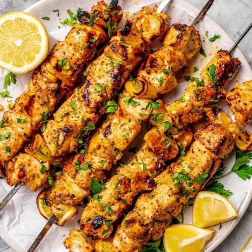 chicken skewers with fresh lemon and black pepper