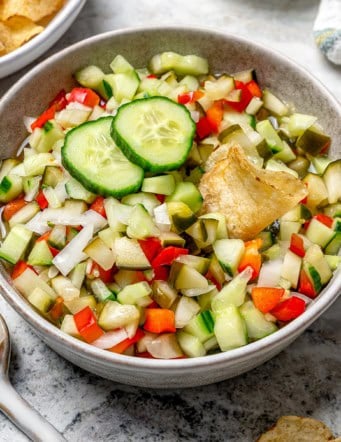 a bowl of chopped pickle salsa, also called pickle de gallo