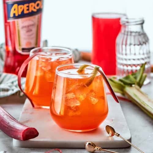 two glasses of Rhubarb Aperol Spritz cocktails