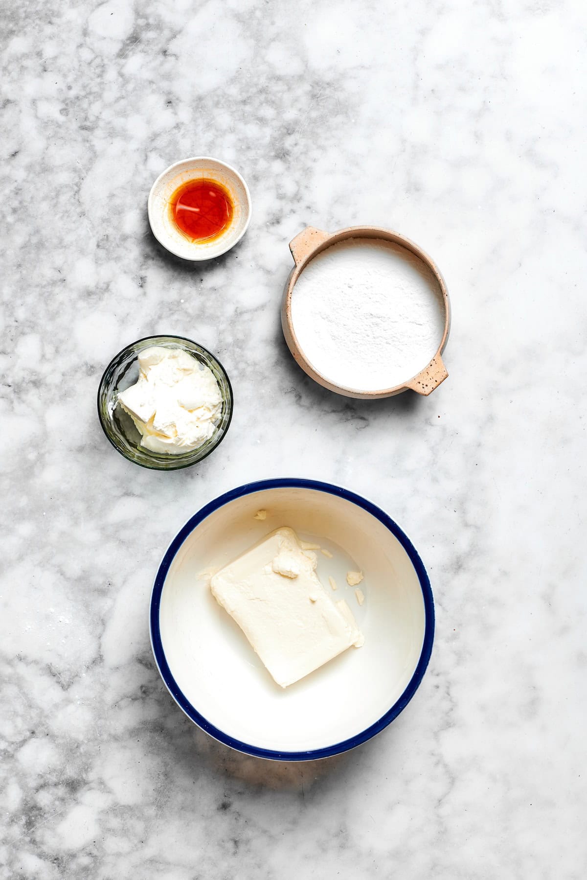 Buttery shortbread is layered with rhubarb custard to create these irresistible Rhubarb Custard Bars. Don't skip the cream cheese topping! Overhead view of ingredients for cream cheese sour cream topping