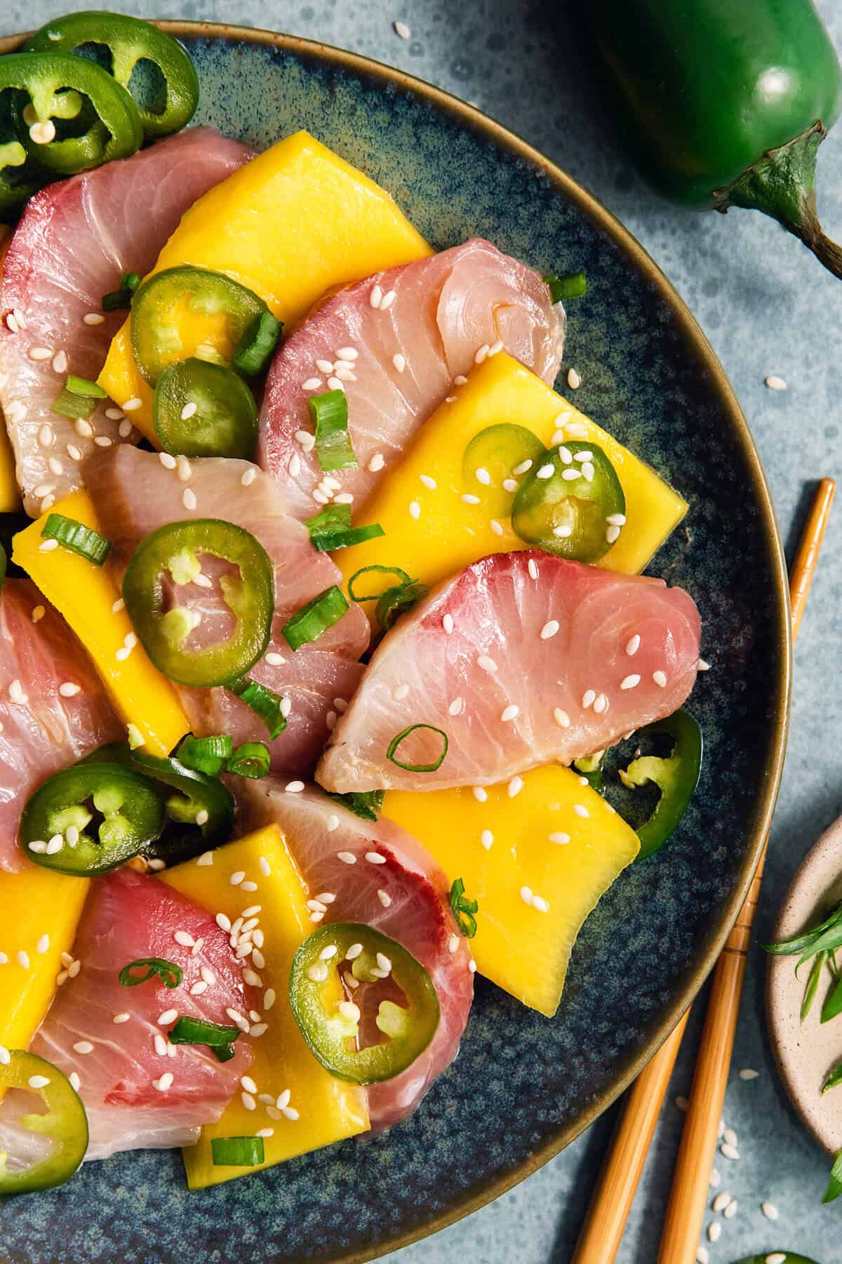 Overhead view of hamachi crudo on plate