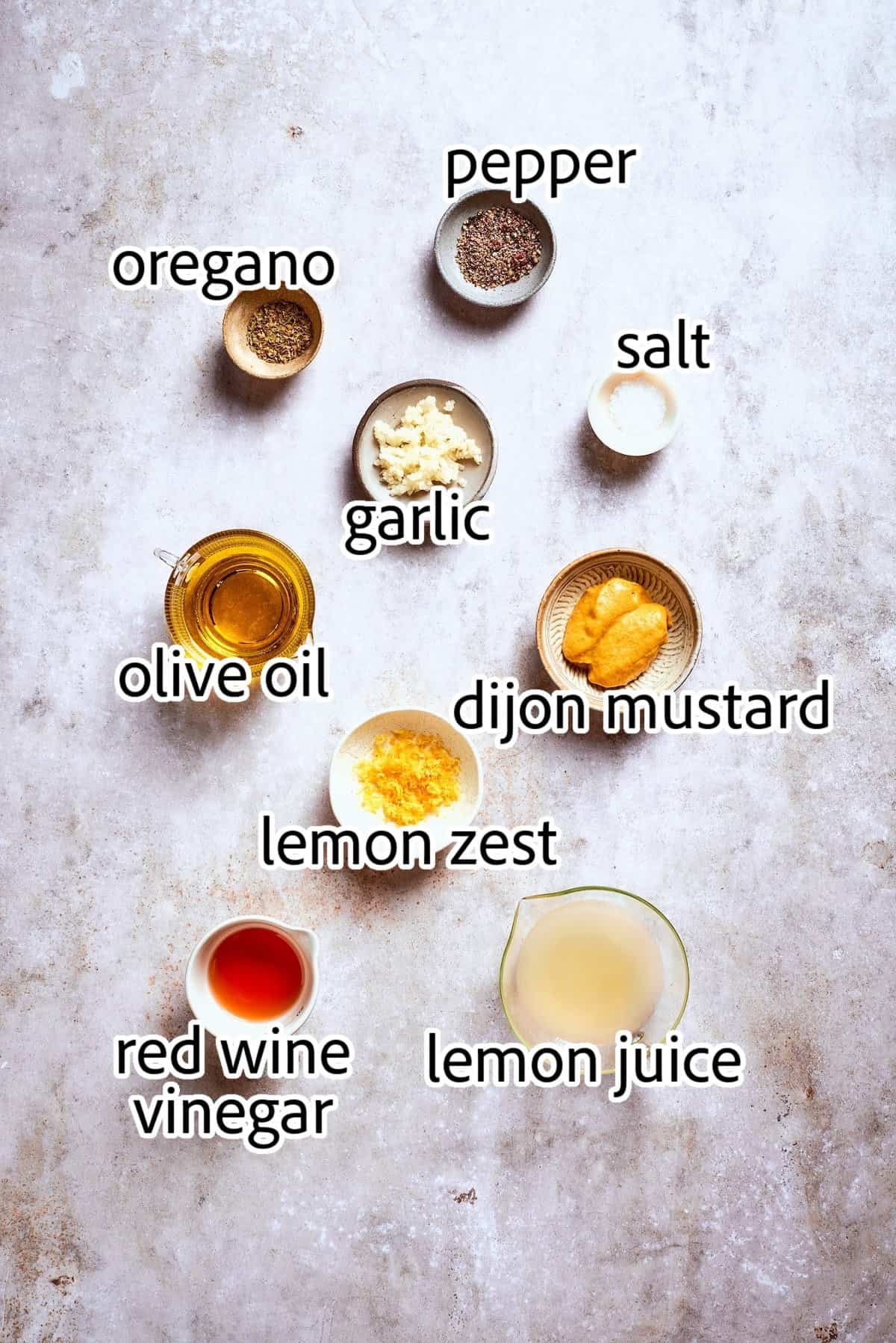 Bright and tangy, with lots of garlic and oregano, this Greek Salad Dressing is easy to make and tastes SO much better than store-bought! ingredients needed for greek salad dressing