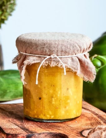 Greek salad dressing in a jar, with a fabric cover