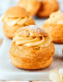 mini cream puffs filled with vanilla pastry cream and dusted with powdered sugar