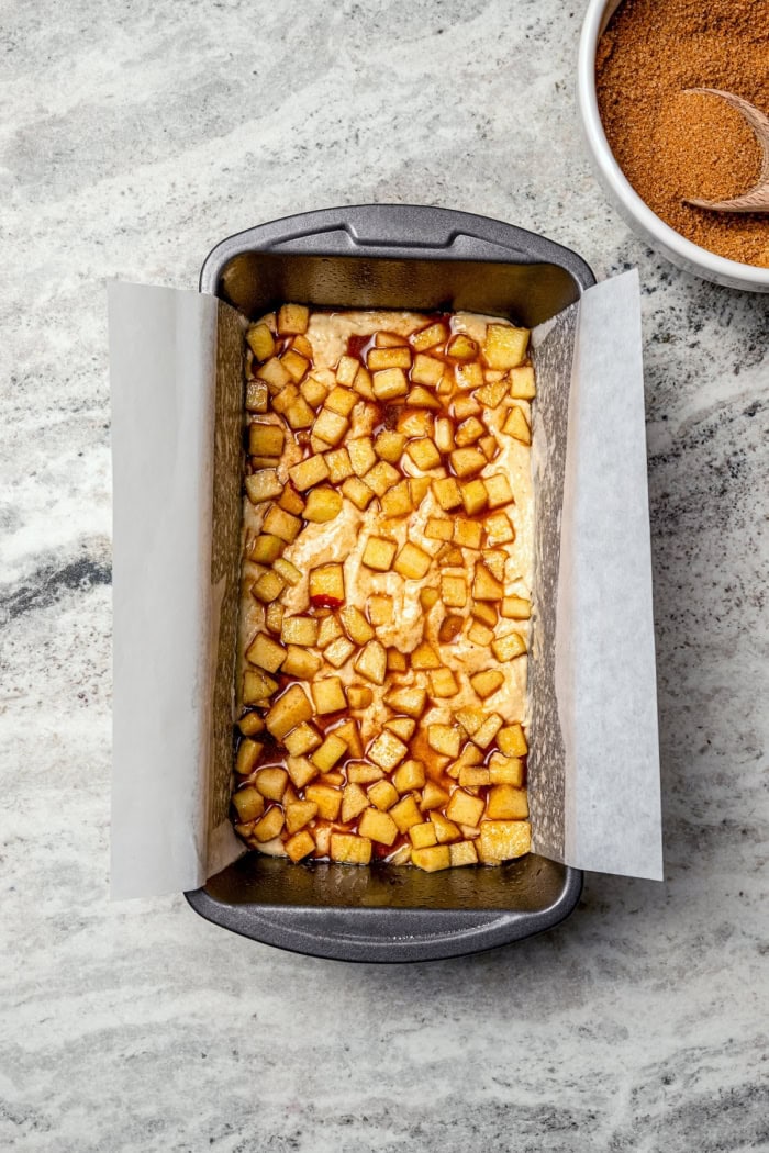 Apple layer in pan for apple fritter bread.