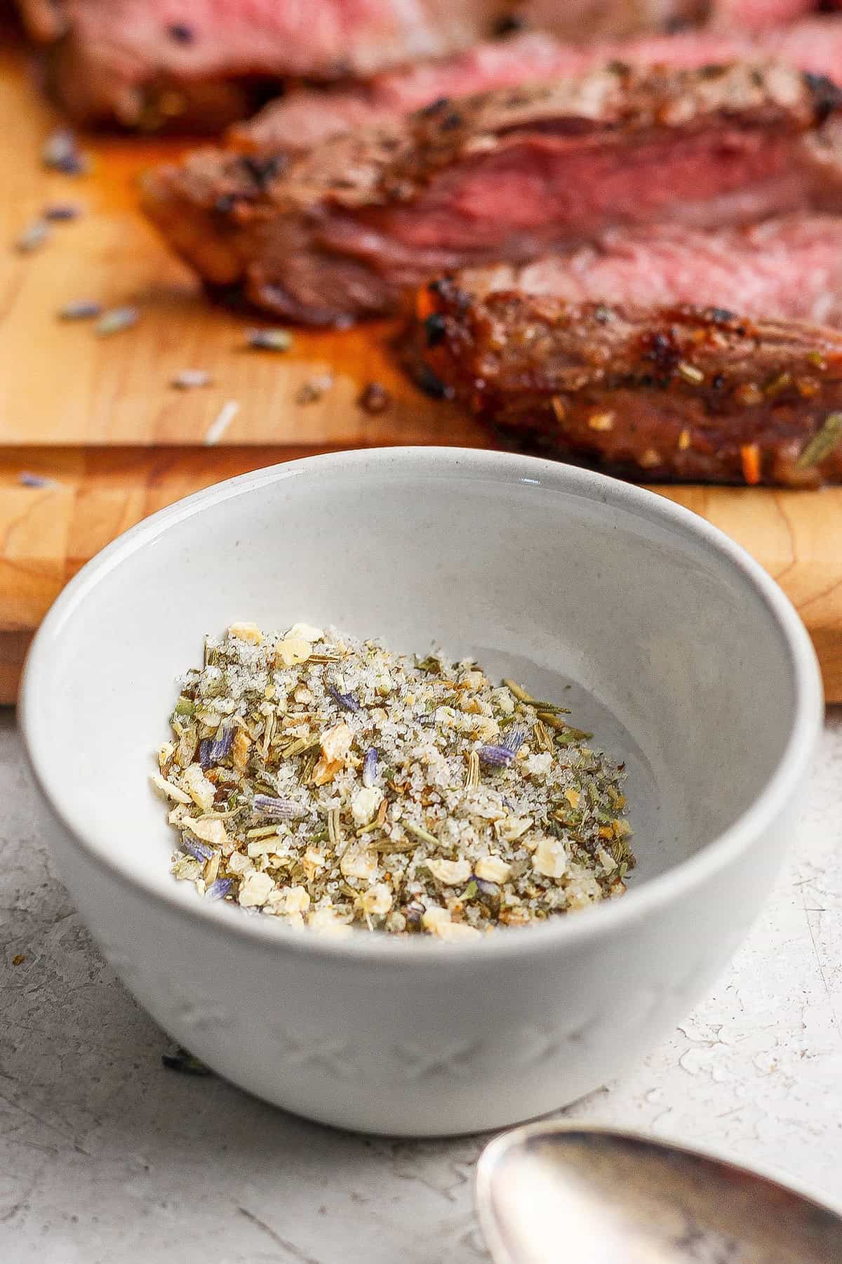 A savory combination of sea salt, toasted onion, black pepper, and herbs make this my family's go-to steak seasoning recipe! Bowl of homemade steak seasoning