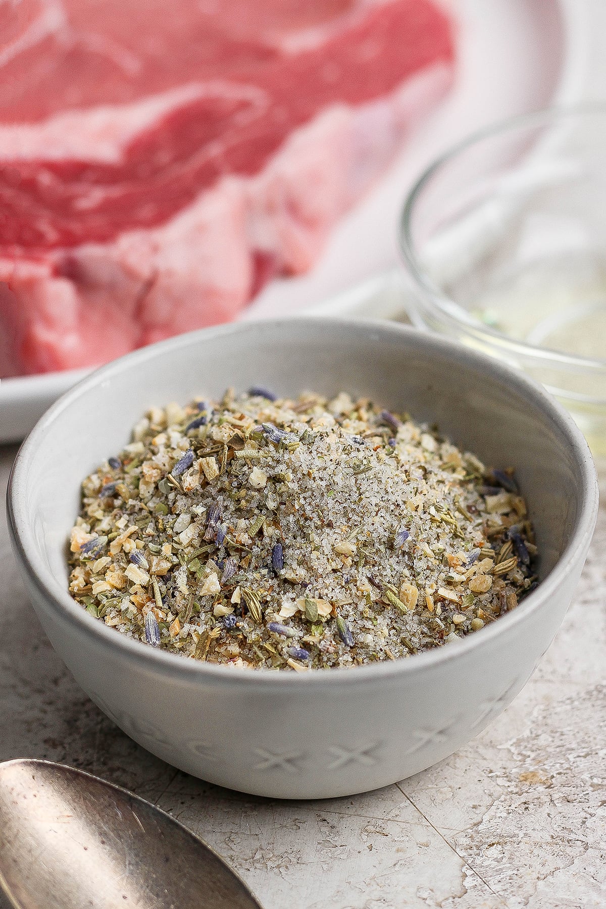 A savory combination of sea salt, toasted onion, black pepper, and herbs make this my family's go-to steak seasoning recipe! Bowl of homemade steak seasoning