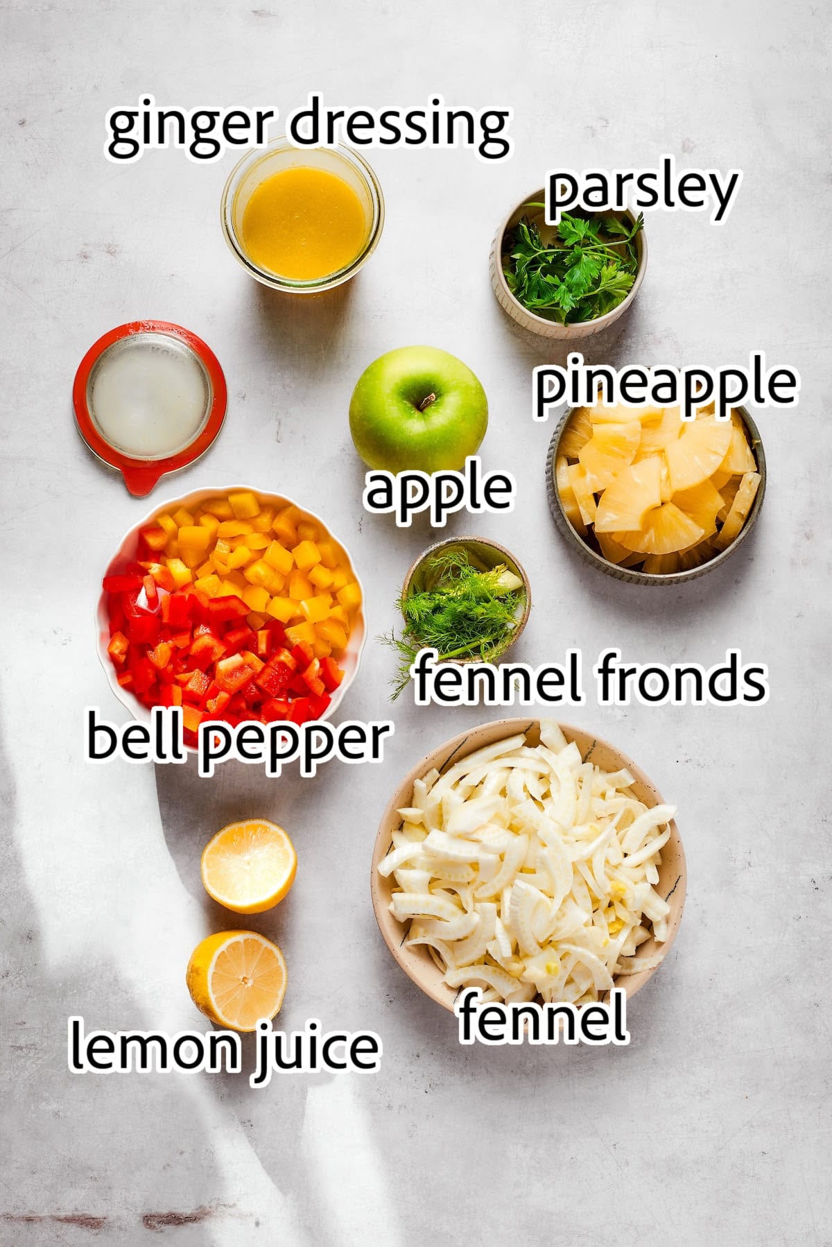This fresh, crisp Fennel Apple Salad with pineapple, bell peppers and ginger dressing is an easy, vibrant side dish perfect for any meal! ingredients needed for fennel salad