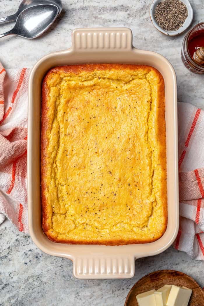This Southern Spoon Bread recipe is fluffy, soft and lightly sweet, like a cross between cornbread and soufflé. A perfect holiday side dish! Spoon bread baked in casserole dish.