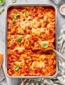 Pan of lazy ravioli lasagna cut into 6 large portions.
