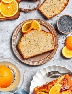 slices of orange poppy seed bread and fresh oranges