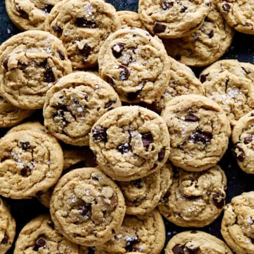 overhead photo of a big spread of peanut butter chocolate chip cookies