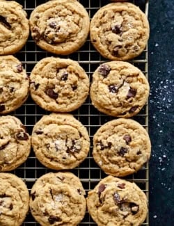overhead photo of peanut butter chocolate chip cookies cooling on a wire rack